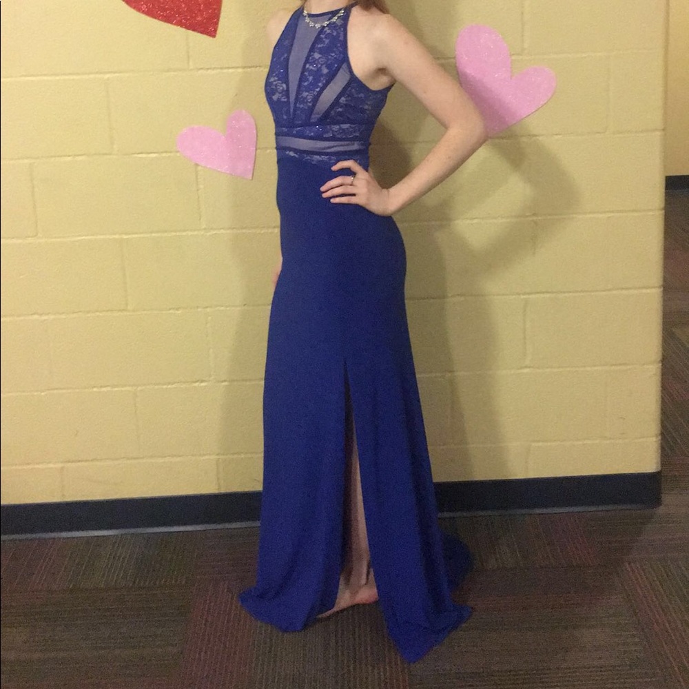 Long blue evening gown w/ slit & halter neckline.